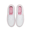 Overhead shot of the GS Nike Air Force 1, highlighting the pristine white leather with pink foam accents