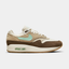 Nike Air Max 1 Crepe Hemp displayed on a white background, highlighting its premium suede mudguard.