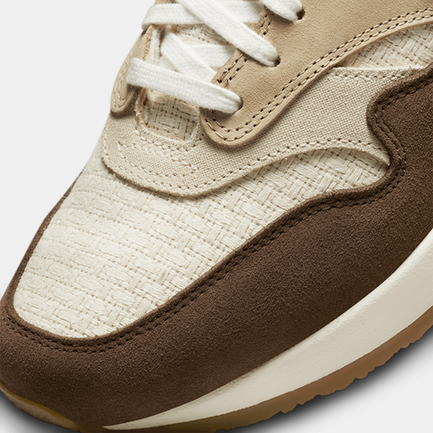 Angled view of the Air Max 1 Crepe's Medium Brown and Natural upper with vibrant Mint Foam accents.